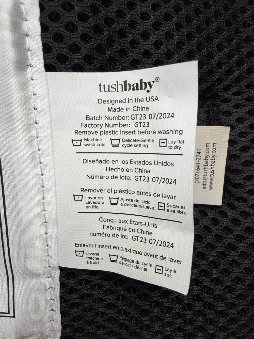 Tushbaby ergonomic hip carrier in black with gold hardware. Adjustable - Picture 7 of 9